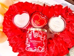 4 threshold valentine's day candles together in a heart wreath