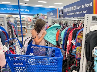 child shopping for backpacks at ross