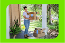 a woman carrying amazon boxes on a porch