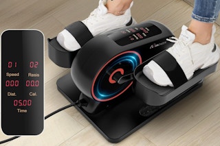 Person using the ANCHEER Under Desk Elliptical Machine on the floor.