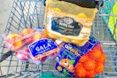 apples oranges potatoes in shopping cart