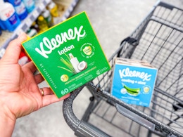 hand holding kleenex tissues in walgreens