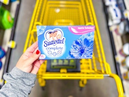 hand holding a box of suavitel dryer sheets