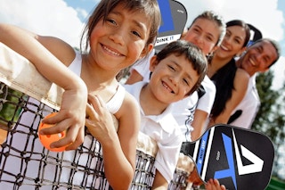 A family playing pickleball