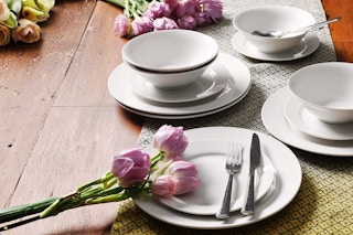 Lifestyle image of the 12-piece Gibson Home Everyday Stoneware Dinnerware Set (white)