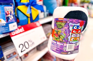 hand holding a character throw blanket at target