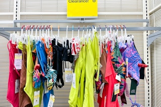 women's swimsuits on clearance sitting on a target rack