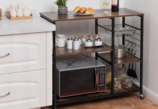 rolling baker's rack in the corner of a kitchen