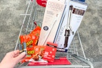 CVS shopping cart with reese's, neutrogena, conair, and revlon products