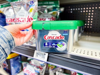 hand holding cascade pods on walmart shelf
