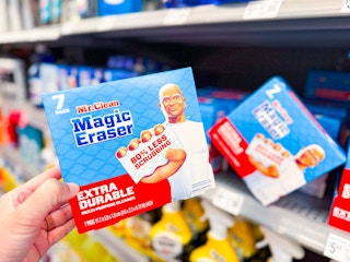 hand holding a pack of mr clean erasers in walmart cleaning aisle