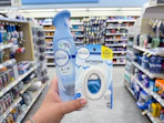 hand holding febreze products in walgreens