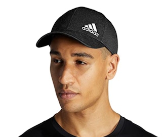 A guy wearing a black cap
