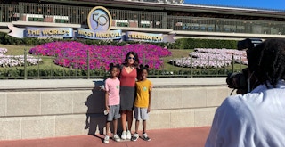 people getting their photo taken with photo pass at disney's magic kingdom