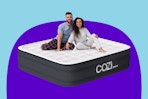 Stock image of the Cozi Air Mattress in size Queen with 2 adults sitting on top
