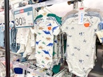 carter's baby bodysuits sitting on a target shelf