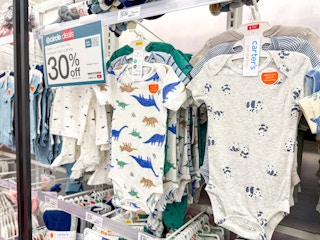 carter's baby bodysuits sitting on a target shelf