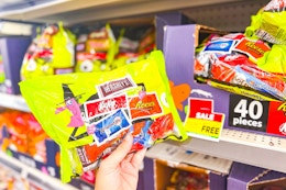 hand holding a bag of hershey's halloween candy