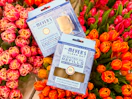 mrs meyers diffuser kit and refill sitting on top flowers