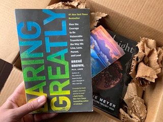 Books being pulled from a box