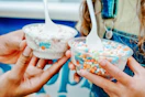 a mom and daughter holding dippin dots