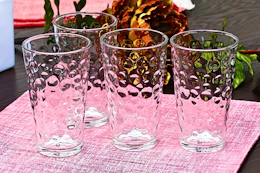 Lifestyle image of the Gibson Home Bubble Glass 4-piece set on a table setting