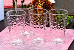 Lifestyle image of the Gibson Home Bubble Glass 4-piece set on a table setting