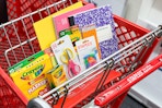 a staples cart filled with school supplies