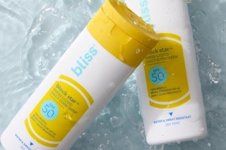 bottles of bliss block star sunscreen in water