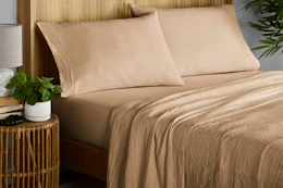Lifestyle image of Fatigue Tan Mainstays Enzyme Washed Microfiber Bed Sheet Set in room setting