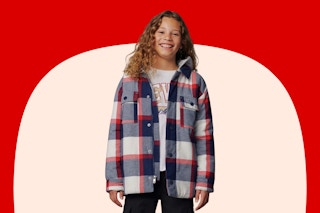 Boy wearing a plaid Levi's shacket in the color "dress blues"