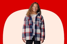 Boy wearing a plaid Levi's shacket in the color "dress blues"