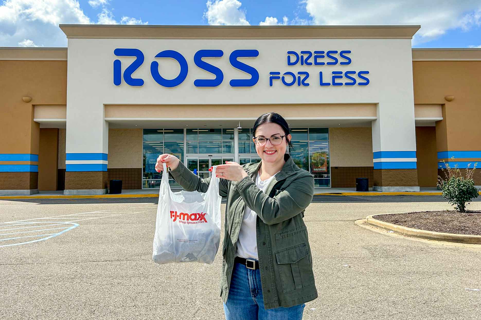 a person holding up a tj maxx bag in front of a ross sign