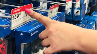 hand points to best buy red tag