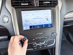 A car radio with sirius XM on the screen.