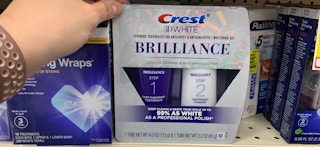 a teeth whitening toothpaste kit on a store shelf