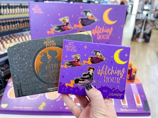 hand holding eyeshadow palettes