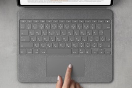 a woman using a keyboard
