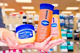 hands holding vaseline healing jelly ointment, shimmering body oil, and cocoa radiant lotion