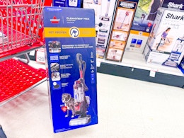 bissell pet lift off vacuum sitting in front a parked target cart