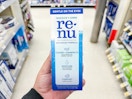 hand holding renu contact solution in walgreens