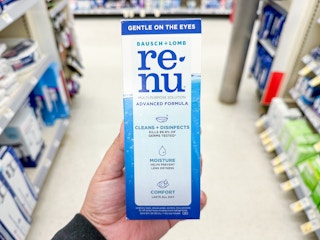 hand holding renu contact solution in walgreens