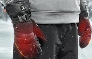 a person with heated mittens on outside 