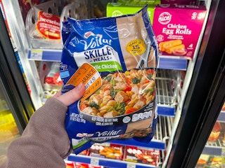person holding a birds eye frozen skillet meal