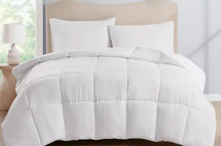 a white comforter on a bed