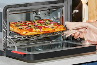 a pizza being cooked in an instant pot oven