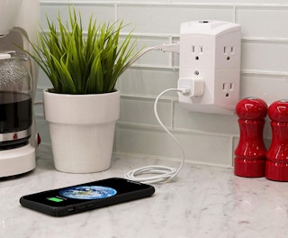 GE white outlet extender in a wall