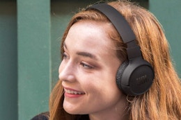 Woman wearing the JBL Tune Wireless Bluetooth Headphones.