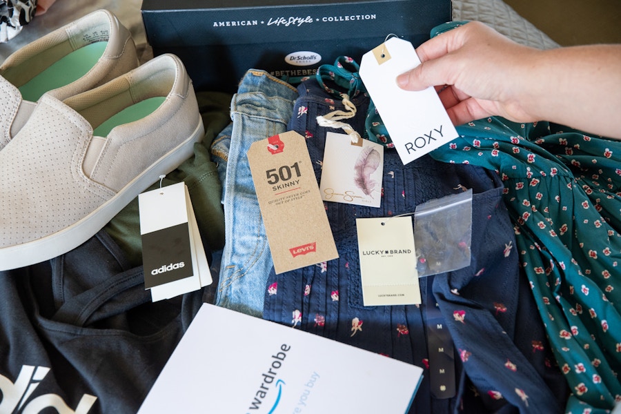 Name brand clothing tags attached to items of clothing