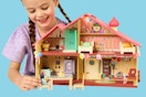 child playing with a Bluey Celebration Home